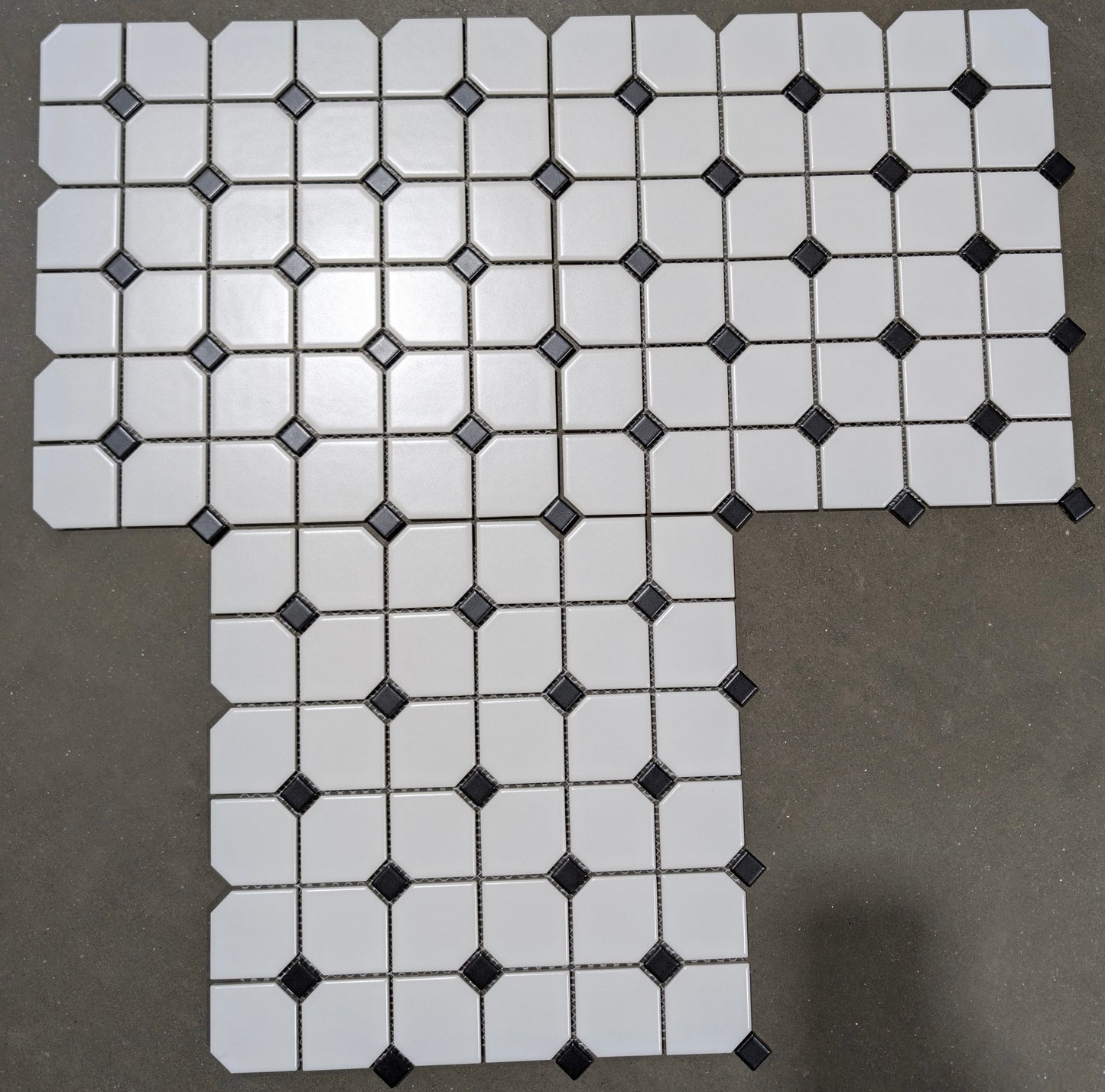 White Elongated Octagon With Black Dot